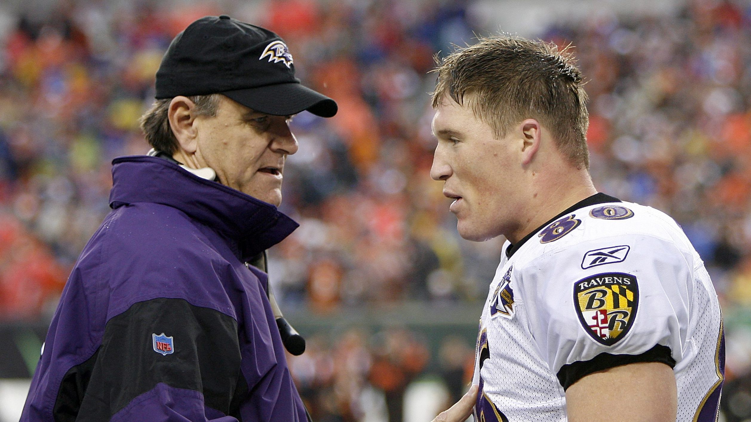 Baltimore head coach Brian Billick (left) talks to tight end Todd Heap after Heap pulled in the fir...
