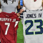 Cardinals CB Byron Murphy (Right) and Seahawks CB Sidney Jones (Left) exchange jerseys after the game 1/09/22 (Jeremy Schnell/Arizona Sports)