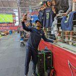 Seahawks RB Adrian Peterson takes a selfie with a fan pregame 1/09/22 (Jeremy Schnell/Arizona Sports)