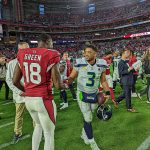 Seahawks QB Russell Wilson and Cardinals WR AJ Green say hello after the game 1/09/22 (Jeremy Schnell/Arizona Sports)
