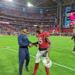 Cardinals LB Chandler Jones and Seahawks RB Adrian Peterson say hello after the game 1/09/22 (Jeremy Schnell/Arizona Sports)