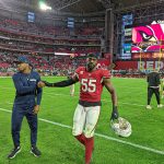 Cardinals LB Chandler Jones and Seahawks RB Adrian Peterson say hello after the game 1/09/22 (Jeremy Schnell/Arizona Sports)