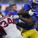 Los Angeles Rams running back Cam Akers, right, runs against Arizona Cardinals free safety Jalen Thompson (34) during the second half of an NFL wild-card playoff football game in Inglewood, Calif., Monday, Jan. 17, 2022. (AP Photo/Mark J. Terrill)