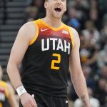 Utah Jazz guard Joe Ingles (2) argues with an official in the first half during an NBA basketball game against the Phoenix Suns Wednesday, Jan. 26, 2022, in Salt Lake City. (AP Photo/Rick Bowmer)