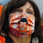 An Oklahoma State fan watches during the first half of the Fiesta Bowl NCAA college football game against Notre Dame, Saturday, Jan. 1, 2022, in Glendale, Ariz. (AP Photo/Ross D. Franklin)