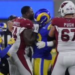 Players try to separate Arizona Cardinals offensive tackle D.J. Humphries, middle left, from Los Angeles Rams defensive end Aaron Donald during the second half of an NFL wild-card playoff football game in Inglewood, Calif., Monday, Jan. 17, 2022. (AP Photo/Mark J. Terrill)