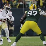 San Francisco 49ers' Deebo Samuel tries to get past Green Bay Packers' Kenny Clark during the first half of an NFC divisional playoff NFL football game Saturday, Jan. 22, 2022, in Green Bay, Wis. (AP Photo/Aaron Gash)