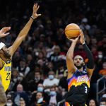 Phoenix Suns guard Chris Paul (3) shoots over Indiana Pacers forward Isaiah Jackson as Pacers forward Oshae Brissett, left, looks on during the second half of an NBA basketball game Saturday, Jan. 22, 2022, in Phoenix. (AP Photo/Ross D. Franklin)
