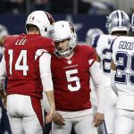 Arizona Cardinals kicker Matt Prater (5) celebrates with Andy Lee (14) after kicking a field goal against the Dallas Cowboys during the second half of an NFL football game Sunday, Jan. 2, 2022, in Arlington, Texas. (AP Photo/Roger Steinman)
