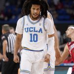 UCLA guard Tyger Campbell looks on after scoring during the first half of an NCAA college basketball game against Arizona Tuesday, Jan. 25, 2022, in Los Angeles. (AP Photo/Mark J. Terrill)