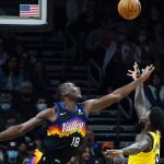 Phoenix Suns center Bismack Biyombo (18) alters a shot by Indiana Pacers guard Lance Stephenson, right, during the second half of an NBA basketball game Saturday, Jan. 22, 2022, in Phoenix. (AP Photo/Ross D. Franklin)