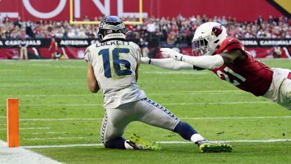 Seattle Seahawks wide receiver Tyler Lockett (16) makes a touchdown catch as Arizona Cardinals corn...