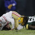 Green Bay Packers' Za'Darius Smith sacks San Francisco 49ers' Jimmy Garoppolo during the first half of an NFC divisional playoff NFL football game Saturday, Jan. 22, 2022, in Green Bay, Wis. (AP Photo/Aaron Gash)