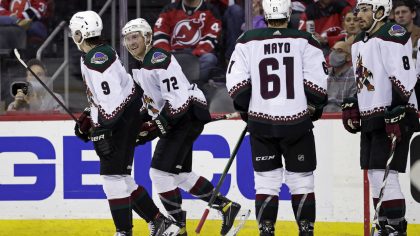 Arizona Coyotes center Travis Boyd (72) celebrates with teammates after scoring a goal against the ...