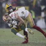 Green Bay Packers' Eric Stokes stops San Francisco 49ers' George Kittle during the second half of an NFC divisional playoff NFL football game Saturday, Jan. 22, 2022, in Green Bay, Wis. (AP Photo/Aaron Gash)