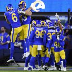 Los Angeles Rams punter Johnny Hekker (6) celebrates with teammates after punting against the Arizona Cardinals during the first half of an NFL wild-card playoff football game in Inglewood, Calif., Monday, Jan. 17, 2022. (AP Photo/Marcio Jose Sanchez)