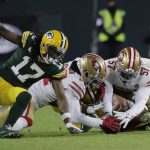 San Francisco 49ers' Dre Greenlaw recovers a fumble during the first half of an NFC divisional playoff NFL football game against the Green Bay Packers Saturday, Jan. 22, 2022, in Green Bay, Wis. (AP Photo/Aaron Gash)