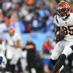 Cincinnati Bengals wide receiver Tee Higgins (85) runs against the Tennessee Titans during the first half of an NFL divisional round playoff football game, Saturday, Jan. 22, 2022, in Nashville, Tenn. (AP Photo/John Amis)