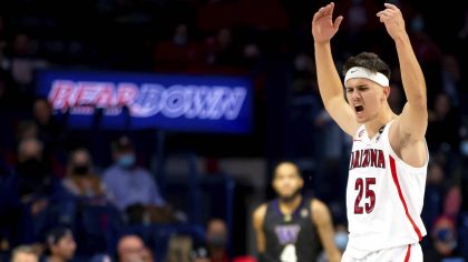 Arizona guard Kerr Kriisa (25) pumps up the crowd during the second half of an NCAA college basketb...