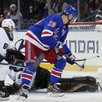 New York Rangers left wing Chris Kreider (20) scores his third goal of the night, past Arizona Coyotes goaltender Scott Wedgewood (31) during the third period of an NHL hockey game Saturday, Jan. 22, 2022, at Madison Square Garden in New York. The Rangers won 7-3. (AP Photo/Mary Altaffer)