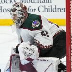 Arizona Coyotes goaltender Ivan Prosvetov makes a save against the Colorado Avalanche during the first period of an NHL hockey game Friday, Jan. 14, 2022, in Denver. (AP Photo/Jack Dempsey)