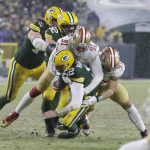 San Francisco 49ers' Arik Armstead sacks Green Bay Packers' Aaron Rodgers during the second half of an NFC divisional playoff NFL football game Saturday, Jan. 22, 2022, in Green Bay, Wis. (AP Photo/Matt Ludtke)