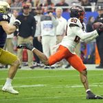 Oklahoma State wide receiver Brennan Presley (80) pulls in a pass against Notre Dame during the first half of the Fiesta Bowl NCAA college football game, Saturday, Jan. 1, 2022, in Glendale, Ariz. (AP Photo/Rick Scuteri)