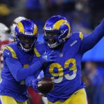 Los Angeles Rams defensive tackle Marquise Copeland (93) celebrates after intercepting a pass against the Arizona Cardinals during the first half of an NFL wild-card playoff football game in Inglewood, Calif., Monday, Jan. 17, 2022. (AP Photo/Mark J. Terrill)