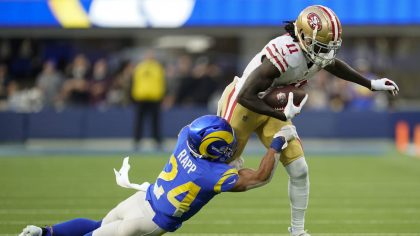 Los Angeles Rams free safety Taylor Rapp (24) tackles San Francisco 49ers wide receiver Brandon Aiy...