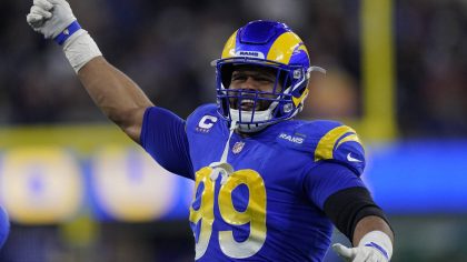 Los Angeles Rams defensive end Aaron Donald (99) celebrates during the first half of an NFL wild-ca...