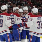 Montreal Canadiens' Christian Dvorak (28), Ryan Poehling (25), Jonathan Drouin (92), Jeff Petry (26), and Rem Pitlick (32) celebrate Poehling's goal during the second period of an NHL hockey game against the Arizona Coyotes, Monday, Jan. 17, 2022, in Glendale, Ariz. (AP Photo/Darryl Webb)