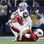 Arizona Cardinals quarterback Kyler Murray (1) is sacked by Dallas Cowboys defensive end Dorance Armstrong (92) during the second half of an NFL football game Sunday, Jan. 2, 2022, in Arlington, Texas. (AP Photo/Michael Ainsworth)