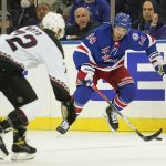New York Rangers center Greg McKegg (14) skates against Arizona Coyotes center Travis Boyd (72) during the first period of an NHL hockey game Saturday, Jan. 22, 2022, at Madison Square Garden in New York. (AP Photo/Mary Altaffer)