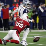 Dallas Cowboys quarterback Dak Prescott (4) fumbles the ball as he is hit by Arizona Cardinals outside linebacker Chandler Jones (55) during the second half of an NFL football game Sunday, Jan. 2, 2022, in Arlington, Texas. The Cowboys recovered the fumble. (AP Photo/Roger Steinman)