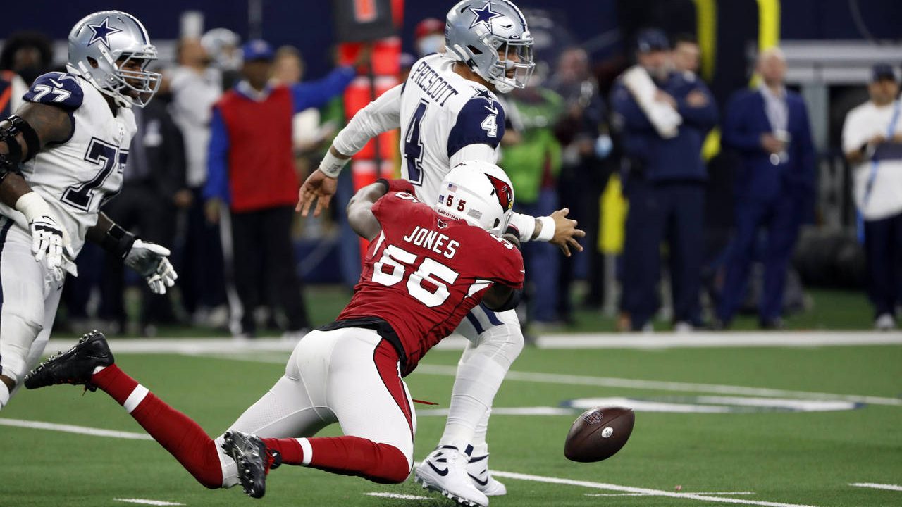 Dallas Cowboys quarterback Dak Prescott (4) fumbles the ball as he is hit by Arizona Cardinals outs...