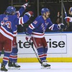 New York Rangers left wing Artemi Panarin (10) celebrates with teammates after scoring a goal during the second period of an NHL hockey game against the Arizona Coyotes, Saturday, Jan. 22, 2022, at Madison Square Garden in New York. (AP Photo/Mary Altaffer)