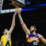 Phoenix Suns center JaVale McGee (00) shoots over Indiana Pacers center Goga Bitadze (88) during the second half of an NBA basketball game Saturday, Jan. 22, 2022, in Phoenix. (AP Photo/Ross D. Franklin)