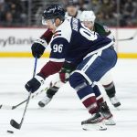 Colorado Avalanche right wing Mikko Rantanen (96) moves the puck against the Arizona Coyotes during the first period of an NHL hockey game Friday, Jan. 14, 2022, in Denver. (AP Photo/Jack Dempsey)