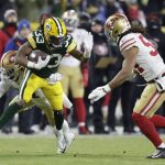 Green Bay Packers' Aaron Jones runs during the first half of an NFC divisional playoff NFL football game against the San Francisco 49ers Saturday, Jan. 22, 2022, in Green Bay, Wis. (AP Photo/Matt Ludtke)