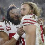 San Francisco 49ers' Fred Warner and George Kittle celebrate after an NFC divisional playoff NFL football game against the Green Bay Packers Saturday, Jan. 22, 2022, in Green Bay, Wis. The 49ers won 13-10 to advance to the NFC Chasmpionship game. (AP Photo/Aaron Gash)