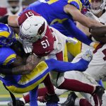 Arizona Cardinals inside linebacker Tanner Vallejo (51) tackles Los Angeles Rams running back Cam Akers during the first half of an NFL wild-card playoff football game in Inglewood, Calif., Monday, Jan. 17, 2022. (AP Photo/Marcio Jose Sanchez)