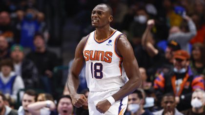 Phoenix Suns forward Bismack Biyombo celebrates after dunking during the second half of an NBA bask...