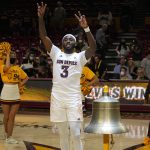 Arizona State guard Marreon Jackson (3) gestures after ringing the victory bell after defeating Utah in an NCAA college basketball game, Monday, Jan. 17, 2022, in Tempe, Ariz. (AP Photo/Rick Scuteri)