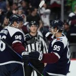 Colorado Avalanche left wing Andre Burakovsky (95) and right wing Mikko Rantanen (96) celebrate a goal against the Arizona Coyotes during the third period of an NHL hockey game Friday, Jan. 14, 2022, in Denver. (AP Photo/Jack Dempsey)