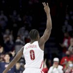 Arizona guard Bennedict Mathurin (0) throws up a three sign after hitting a long range shot during the first half of an NCAA college basketball game against Colorado Thursday, Jan. 13, 2022 in Tucson, Ariz. (Kelly Presnell/Arizona Daily Star via AP)