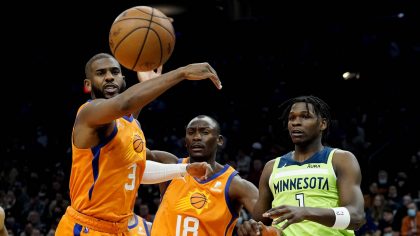 Phoenix Suns guard Chris Paul (3) reaches for a loose ball as Minnesota Timberwolves forward Anthon...