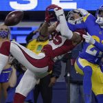 Los Angeles Rams cornerback Donte' Deayon, right, breaks up a pass intended for Arizona Cardinals wide receiver Antoine Wesley during the second half of an NFL wild-card playoff football game in Inglewood, Calif., Monday, Jan. 17, 2022. (AP Photo/Mark J. Terrill)
