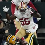 San Francisco 49ers' Samson Ebukam sacks Green Bay Packers' Aaron Rodgers during the first half of an NFC divisional playoff NFL football game Saturday, Jan. 22, 2022, in Green Bay, Wis. (AP Photo/Morry Gash)