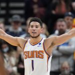 Phoenix Suns guard Devin Booker (1) reacts in the second half during an NBA basketball game against the Utah Jazz Wednesday, Jan. 26, 2022, in Salt Lake City. (AP Photo/Rick Bowmer)