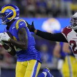 Los Angeles Rams wide receiver Van Jefferson, left, catches a pass against Arizona Cardinals cornerback Marco Wilson during the second half of an NFL wild-card playoff football game in Inglewood, Calif., Monday, Jan. 17, 2022. (AP Photo/Mark J. Terrill)
